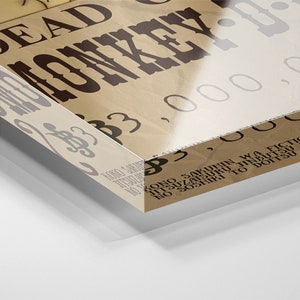 May include: A vintage-style poster with the text "DEAD MONKEY-D" and a large number "3,000,000". The poster has a distressed, aged look and is printed on a brown paper background.