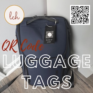 May include: A navy blue backpack with a black luggage tag attached. The tag has a QR code and the text "SCAN IF LOST". The image also includes the text "QR Code LUGGAGE TAGS".
