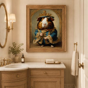 May include: A framed wall art print featuring a guinea pig dressed in a royal blue velvet coat with gold trim and a golden crown. The guinea pig has brown, white, and black fur and is depicted standing within an arched architectural frame.