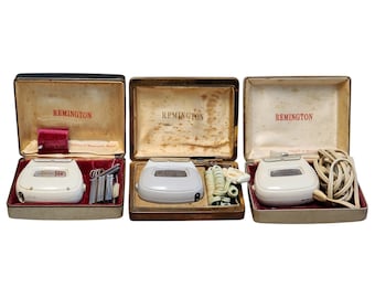 Trio of 1950s English Remington Rollectric Razors and Cases