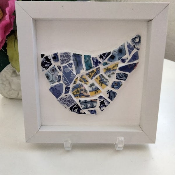 Charming mosaic bird made from broken China pieces and framed for instant enjoyment. Size 6X6 inches.