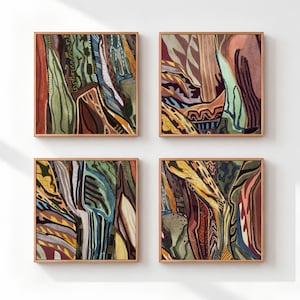 May include: A set of four square wall art pieces in wooden frames, each featuring abstract patterns with layered lines and shapes in earthy tones of olive green, mustard yellow, deep brown, terracotta, and muted blue, arranged in a two-by-two grid.