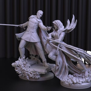 Puede incluir: Una figura gris, impresa en 3D, de un hombre y una mujer en una pose dramática. El hombre sostiene un bastón y la mujer una espada. Ambas figuras están de pie sobre una base con un diseño de fuego.