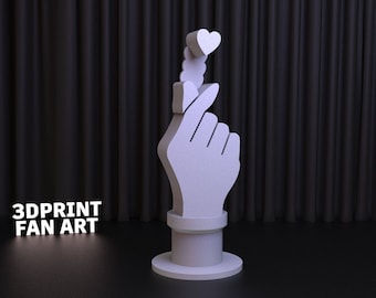 May include: A light purple 3D-printed sculpture of a hand making a heart shape with the fingers. The sculpture has a heart at the tip of the fingers. The text "3DPRINT FAN ART" is at the base of the sculpture.