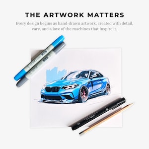 May include: A hand-drawn illustration of a blue sports car on white paper, accompanied by two Copic Ciao markers in blue and grey, a black Uni Pin fine line pen, and a wooden pencil. The text reads: THE ARTWORK MATTERS. Every design begins as hand-drawn artwork, created with detail, care, and a love of the machines that inspire it.
