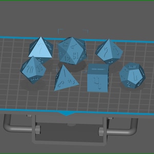 May include: A set of seven blue polyhedral dice with various numbers and symbols on each face. The dice are arranged on a gray grid surface.