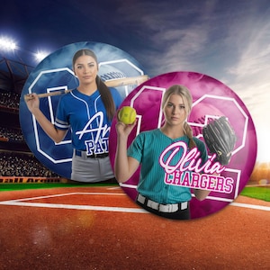 May include: Two women in softball uniforms stand in front of large, circular graphics. One wears a blue jersey with "Av Pat" on it, holding a bat. The other wears a teal jersey and holds a softball and glove. The graphics have the number "62" on them.
