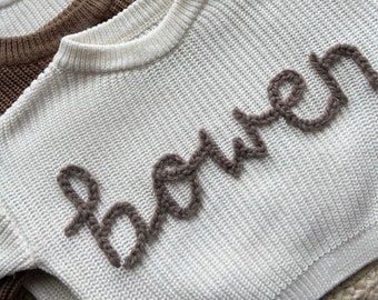 Personalised baby and toddler sweaters, carefully free hand-embroidered with Alpaca Yarn. Perfect for every occasion!