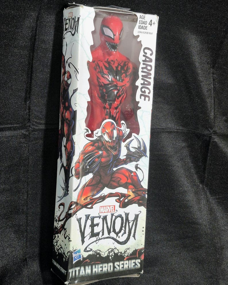 May include: A Carnage action figure from the Marvel Venom Titan Hero Series in its original white packaging. The box features red and black graphics of the character, the text Carnage, Marvel Venom, and Titan Hero Series, with an age 4+ label.