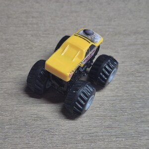 Hot Wheels Mini Monster Truck & Monster Jam Lot.  Includes Hot Wheels Monster Jam Shocker, Yellow body Wrecking Crew, Ford Mustang with flame graphics & Monster Jam El Toro Loco vehicle with pull back friction motor. El Toro is missing a horn, otherwise Lot is in Good Preowned Condition.