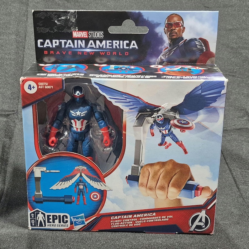 May include: A Captain America Brave New World action figure set in its original packaging. The box features a blue and red Captain America figure, a detachable wing accessory, and a flight control handle. The packaging includes Marvel Studios branding.