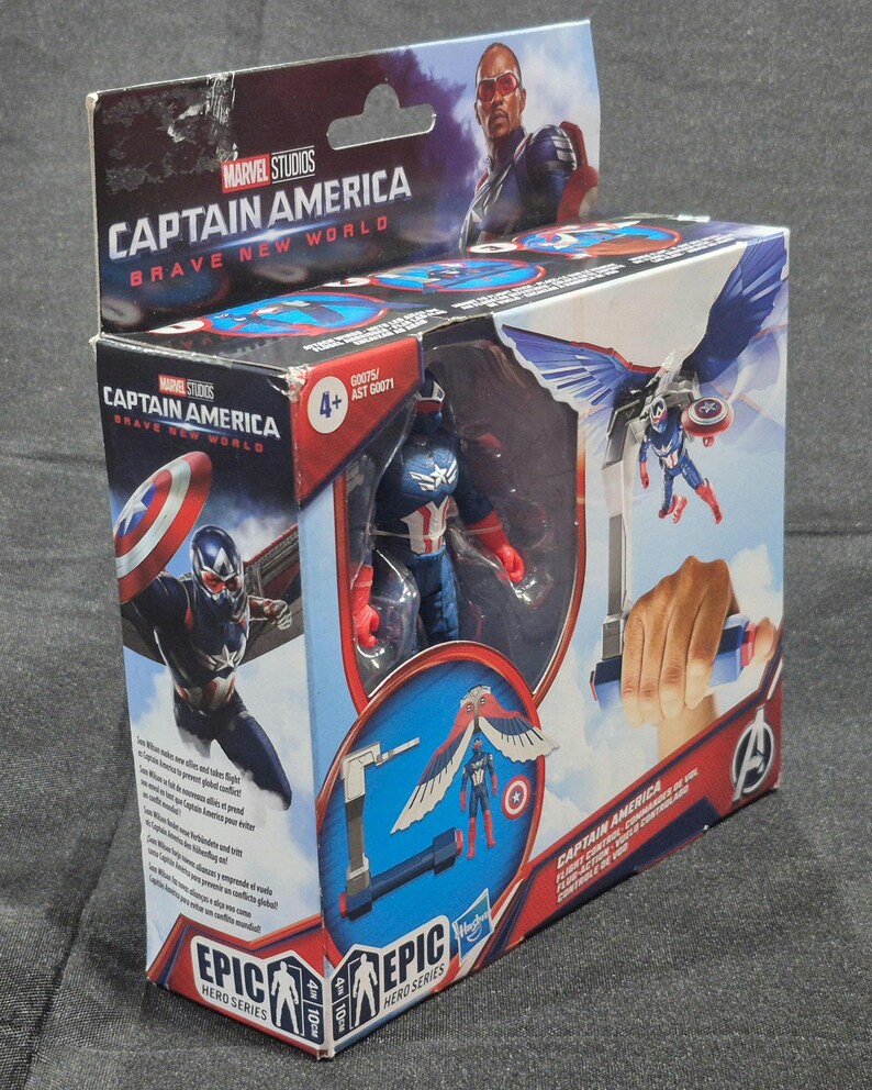 May include: A Marvel Studios Captain America Brave New World Epic Hero Series action figure in its original packaging. The box features graphics of the character with wings, a shield, and flight control accessories, with a 4+ age rating visible.