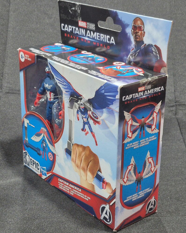 May include: A Marvel Studios Captain America Brave New World action figure in its original packaging. The box features a blue and red Captain America figure with wings, flight control accessories, and graphics showing flight and strike modes.
