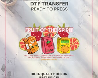 May include: DTF transfer design featuring the text "Fruit of the Spirit" above illustrations of juice boxes and fruit slices. The design includes the text "Love, Joy, Peace..." and "Galatians 5:22-23".