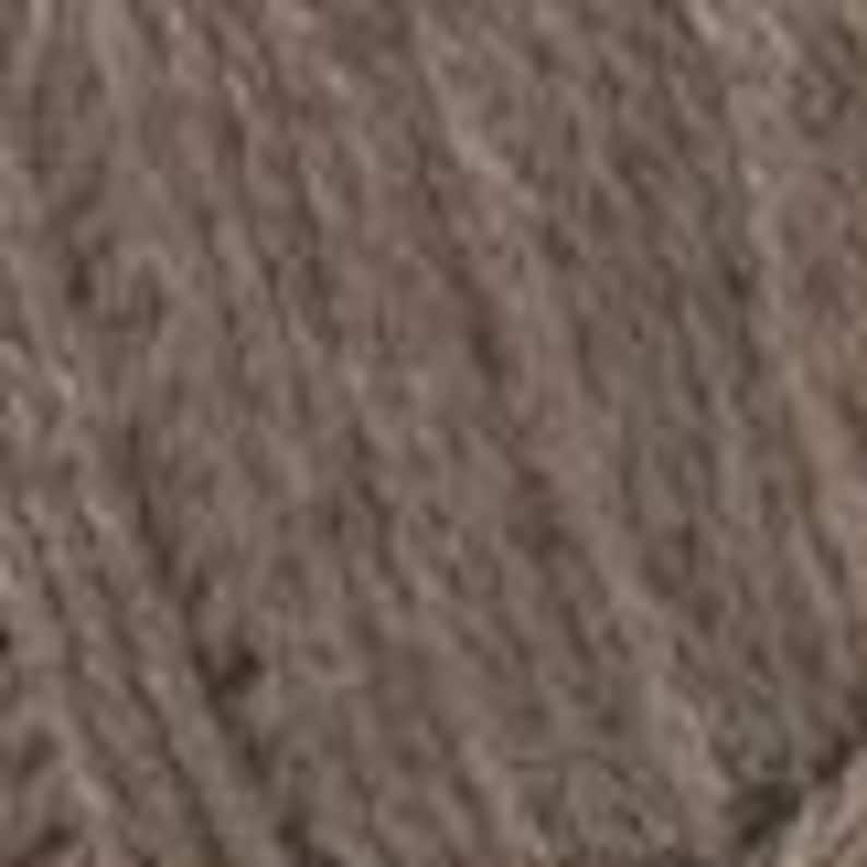 May include: Close-up of a skein of brown yarn. The yarn has a soft, textured appearance, with visible fibres and a slightly uneven surface. The colour is a muted, earthy brown, suitable for various knitting or crochet projects.