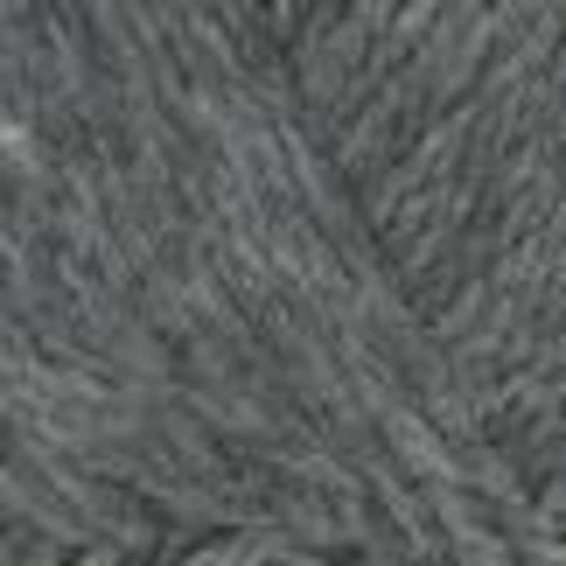 May include: Close-up of a skein of grey yarn. The yarn appears soft and textured, with visible strands and a slightly fuzzy appearance. The colour is a medium grey, suitable for various knitting or crochet projects.