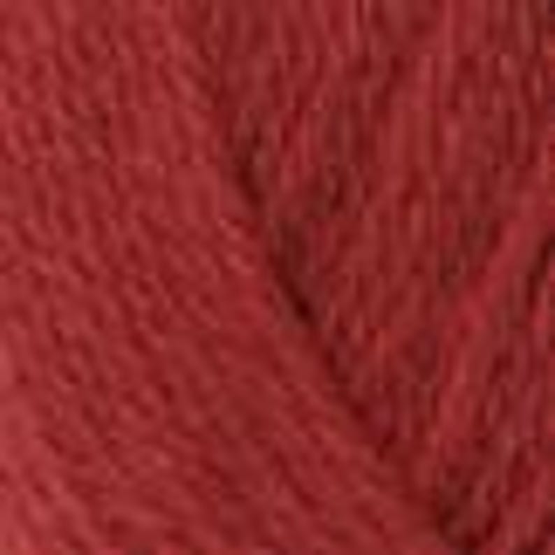 May include: A close-up of a skein of red yarn. The yarn appears soft and fluffy, with a slightly textured surface. The colour is a deep, rich red, suggesting a warm and inviting texture.