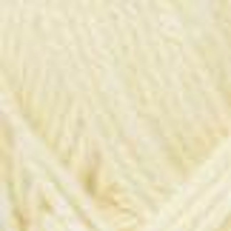 May include: A skein of soft, pale yellow yarn. The yarn appears to be tightly wound, with visible strands and a slightly textured surface. The colour is a creamy, off-white hue, suggesting a natural fibre. Ideal for knitting or crocheting projects.