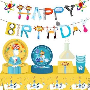 May include: A science-themed birthday party set with a yellow tablecloth, blue and yellow plates, blue cups, and yellow napkins. The banner says "Happy Birthday" with science-themed decorations.
