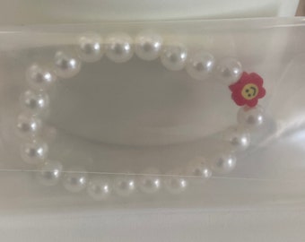 Pulsera de flores rojas