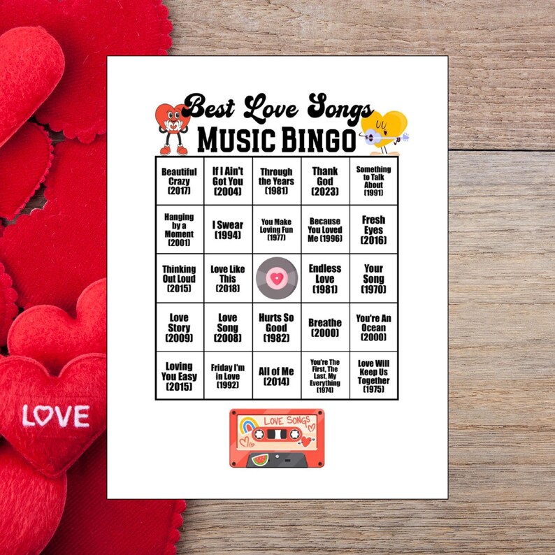 May include: A white sheet of paper with a "Best Love Songs Music Bingo" game. The bingo card features song titles and years, with a red cassette tape graphic at the bottom. Red heart decorations are in the background.