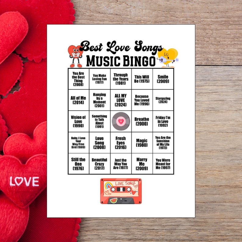 May include: A white Best Love Songs Music Bingo game card with song titles and years, featuring heart graphics. A red cassette tape graphic with the words "Love Songs" is at the bottom. Red heart decorations are in the background.