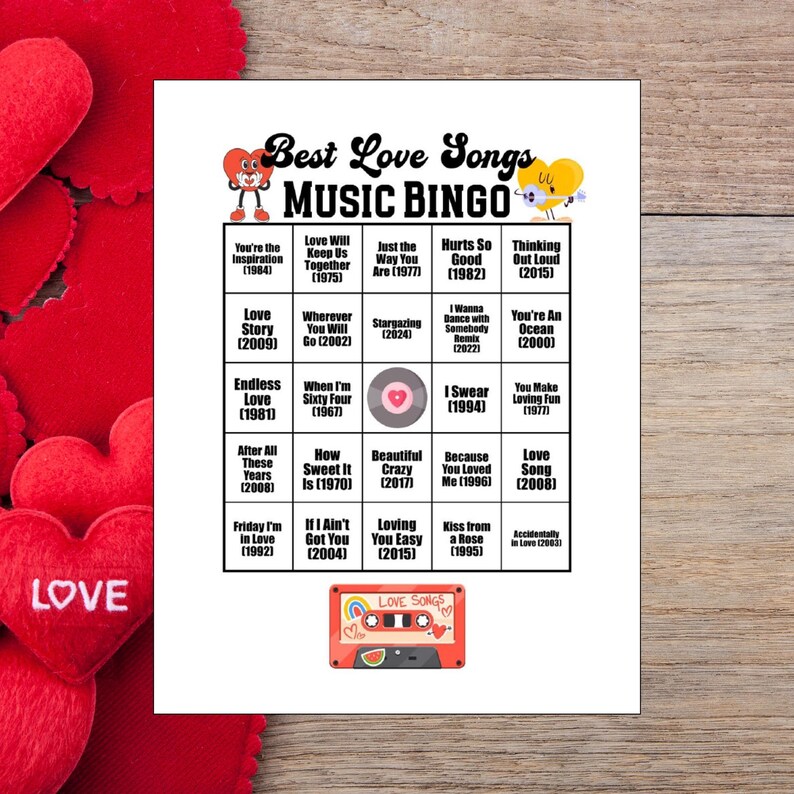 May include: A white sheet of paper with a "Best Love Songs Music Bingo" game. The bingo card features song titles and years, with a retro cassette tape graphic at the bottom. Red heart decorations are in the background.
