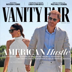May include: A magazine cover featuring a couple, Meghan Markle and Prince Harry, in a white setting. The magazine is titled "Vanity Fair" and the cover story is "American Hustle: Five Years After Leaving the Monarchy, Meghan and Harry Are Trying Their Damnedest to Just Be Normal Moguls" by Anna Peller.
