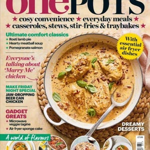 May include: A magazine cover for goodFOOD featuring a recipe for "Marry Me" chicken. The cover features a close-up of a white casserole dish filled with creamy chicken and a red sauce. The magazine cover also features a variety of other recipes, including turmeric cod and chickpea traybake, feijoada, fig and raspberry crumble cake, and panang chicken curry.