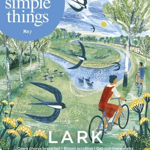 May include: Magazine cover illustration with the title "the simple things" and the month "May". The image features a scenic landscape with a river, cyclists, and swallows. The word "LARK" is prominently displayed.