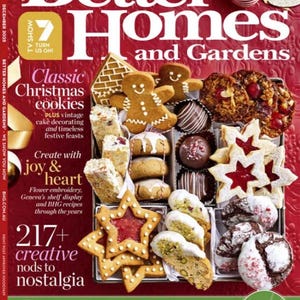 May include: A festive magazine cover for Better Homes and Gardens, featuring a selection of Christmas cookies. Gingerbread figures, star-shaped biscuits with red jam, and other treats are arranged on a red background. The magazine's title and issue date are visible.