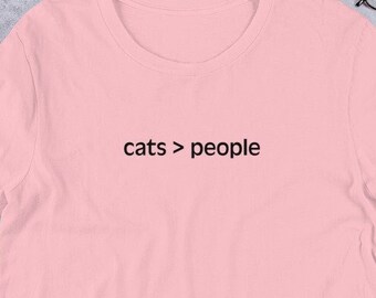 猫 > 人 - ユニセックス T シャツ