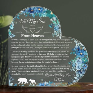 May include: An acrylic plaque in the shape of a heart, decorated with a blue floral design and the words "To My Son From Heaven". The plaque contains a heartfelt message from a mother to her son, ending with "With All My Love, Mom".