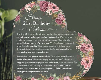 May include: A heart-shaped card with a floral design and the text "Happy 21st Birthday Sabrina". The card has a message about turning 21 and celebrating the person's growth and maturity.