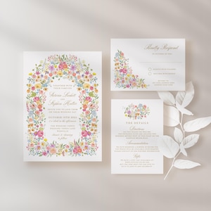 May include: A floral wedding invitation suite with a watercolor floral border. The invitation features the names "Sabrina Scott" and "Stephen Miller" and the wedding date "October 10th, 2023". The RSVP card includes a "Kindly Respond" heading and a space for guests to indicate their attendance.