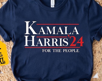 May include: Navy blue t-shirt with white text that reads "Kamala Harris '24 For The People".