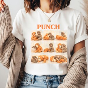 A woman wearing a white t-shirt with a graphic design of multiple teddy bears in various poses.
