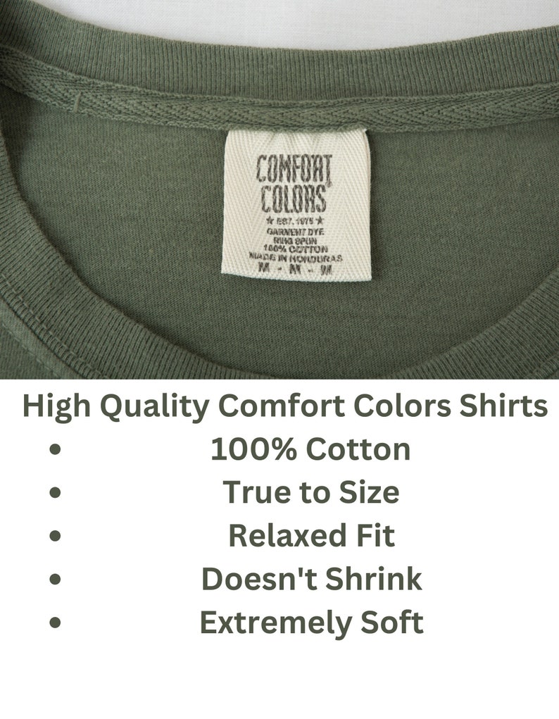 May include: A green t-shirt with a white tag that reads "Comfort Colors" and "Est. 1975" with the text "Garment Dye Ring Spun 100% Cotton Made in Honduras" on the tag. The t-shirt is described as "High Quality Comfort Colors Shirts 100% Cotton True to Size Relaxed Fit Doesn't Shrink Extremely Soft."