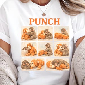 A white t-shirt with a collage of nine images depicting various animals, including bears and elephants, in different poses and expressions.