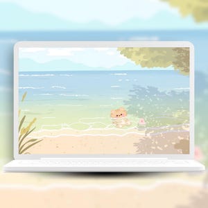 May include: A white laptop displays a serene beach scene. The screen shows a cartoon cat in the ocean, with a sandy shore, blue water, and a light blue sky. The laptop is on a sandy surface.