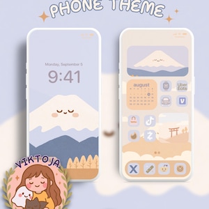Puede incluir: Dos teléfonos inteligentes que muestran un tema digital con una paleta de colores azul claro y beige. Las pantallas presentan una montaña de dibujos animados con cara, un calendario de agosto e iconos de aplicaciones. El logo VIKTOJA Designs es visible.