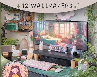 May include: A pink keyboard with a green and white mouse mat on a desk with a computer monitor displaying a cartoon image of a bedroom with a bed and windows. The monitor is on a stand with a small white rabbit figurine. The desk is decorated with plants and other small items. The text "12 WALLPAPERS" is visible at the top of the image.