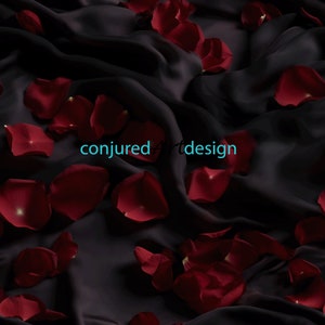 May include: Red rose petals scattered on a black satin fabric. The text "conjured art design" is visible in the center of the image.