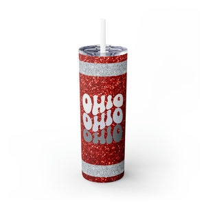 May include: Red glitter tumbler with a silver glitter stripe and the word "Ohio" repeated three times in a retro font.