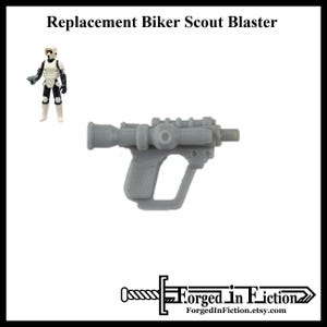 May include: A gray plastic blaster, a replacement for a Star Wars Biker Scout blaster. The blaster has a long barrel and a pistol grip.