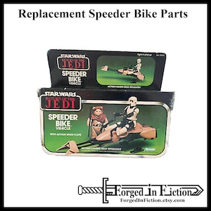 May include: Two vintage Star Wars Return of the Jedi Speeder Bike toy boxes. The boxes are black with red and white text. The boxes feature images of the Speeder Bike with action figures.