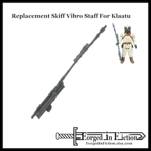 May include: A gray plastic replacement vibro staff for a Star Wars action figure. The staff is about 18 inches long and has a detailed design.