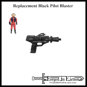 May include: Black plastic blaster, a replacement part for a vintage action figure.  The blaster has a barrel, a handle, and a trigger.