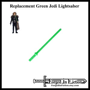 May include: A green lightsaber replacement part for a vintage Star Wars action figure. The lightsaber is made of plastic and is approximately 10 inches long.