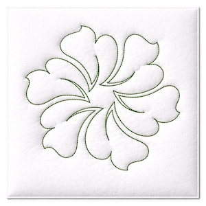 May include: A white square featuring a green floral design. The design comprises curved, petal-like shapes arranged in a circular pattern. The petals are outlined with green stitching, creating a textured effect.